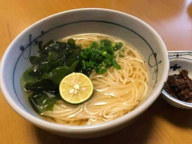 Handa somen with a seasoning beside the plate