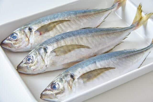 raw aji on white plate