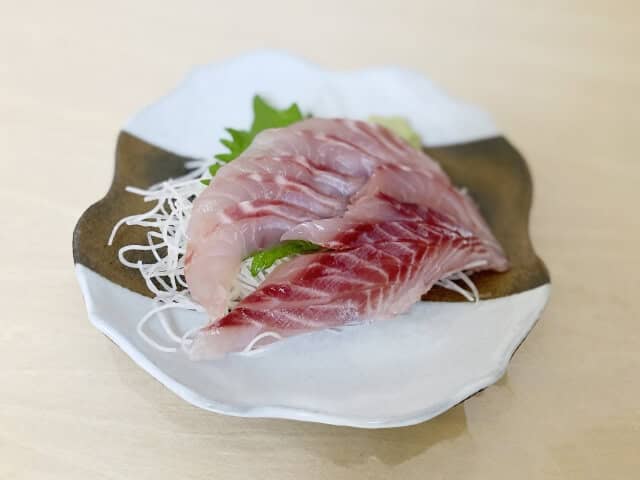 young yellowtail on white plate