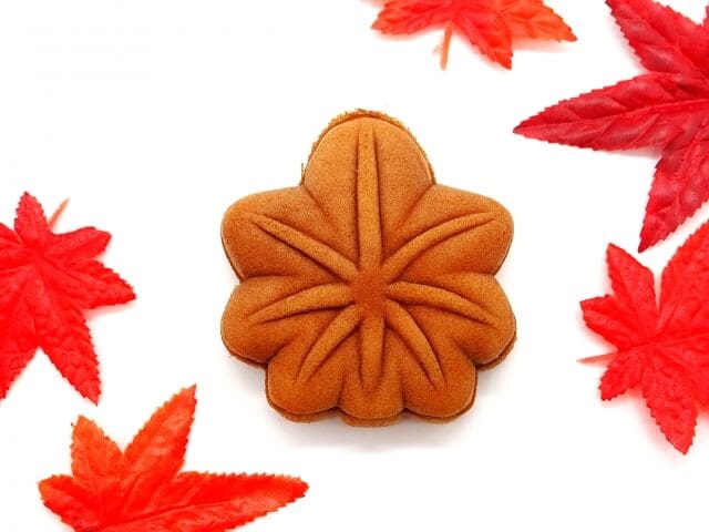 Momiji manju with maple leaf around it