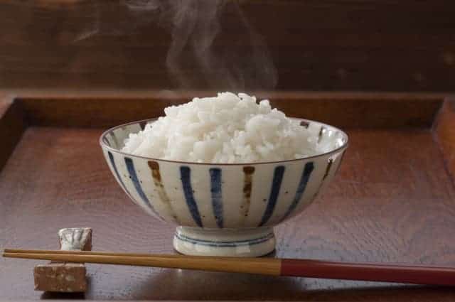 Hot rice with chopsticks